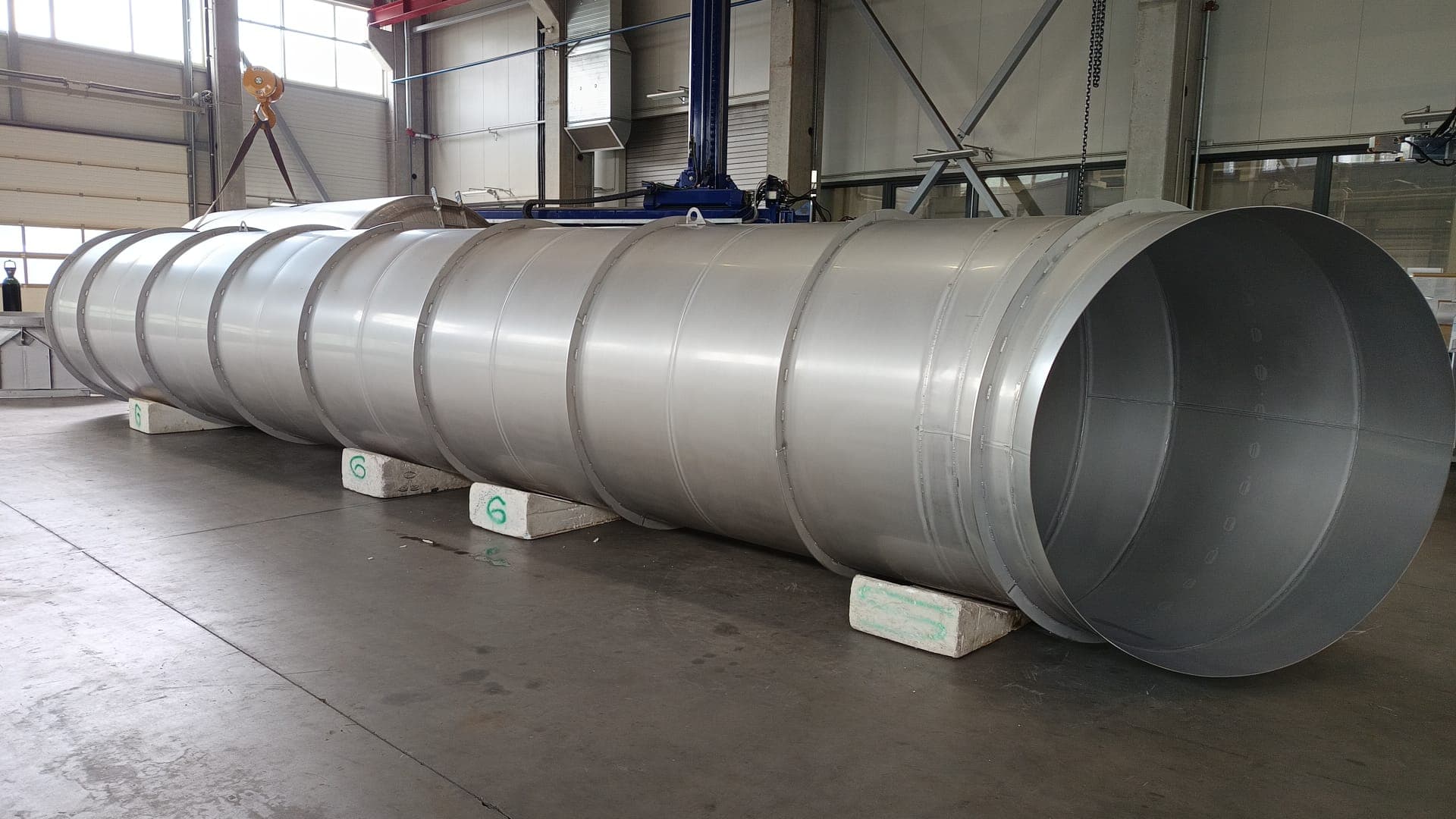 Fabricated steel gas ducts in a workshop